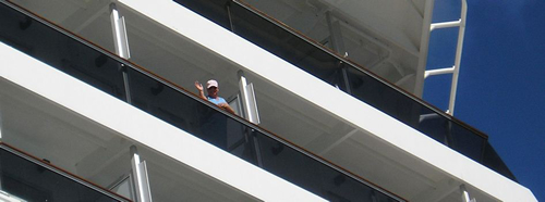 woman waving from cruise ship